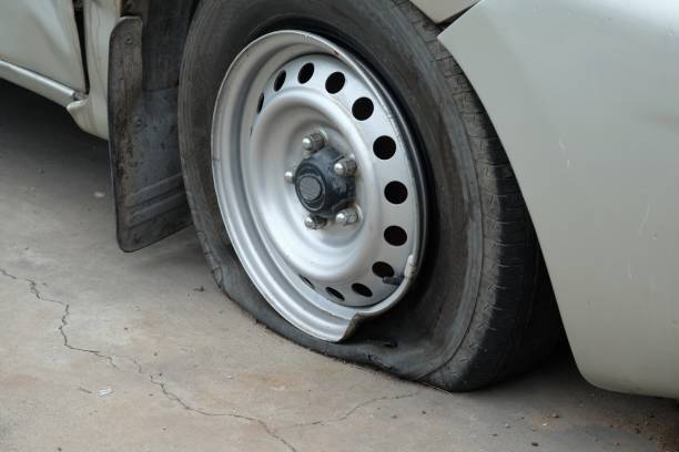 istock closeup damaged car tire from car crash accident 944667472