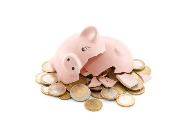 istock Broken piggy bank with Euro coins on white background with clipping path 944667616