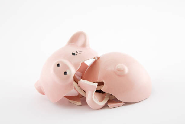 istock Broken piggy bank on white background 944667628
