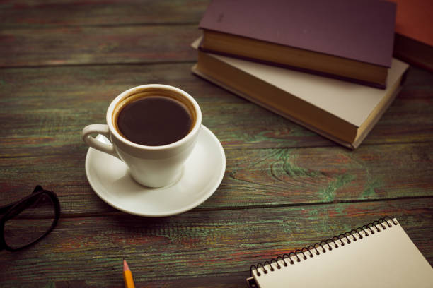 istock A cup of coffee in the workplace on a wooden table. 944670940
