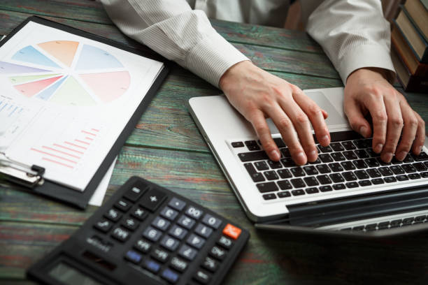 istock Business man calculate about cost and doing finance at office 944675768