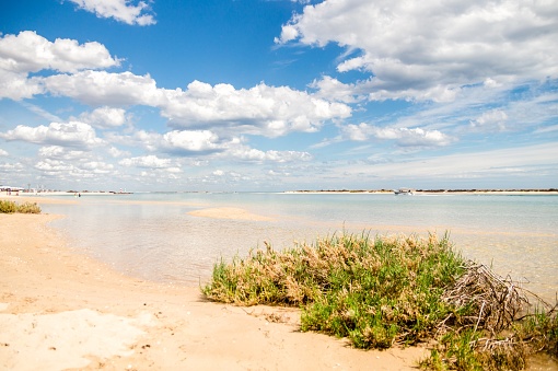 Sunny view of the local beach in Fuseta, Ria Formosa Natural park, Portugal