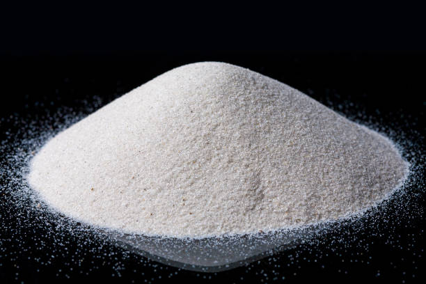 istock Pile of White Sand Isolated on darck Background. 944677418