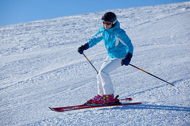 istock woman skiing on groomed slope 94468074