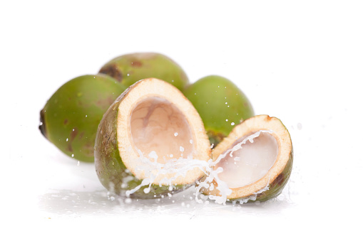 Cool  young coconut juice with water droplets isolated on white background. Clipping path.