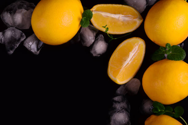 istock Lemons isolated on the black background. Top view 944686350