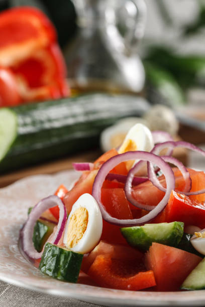 istock fresh vegetable salad with quail eggs in pink plate on the table 944690760