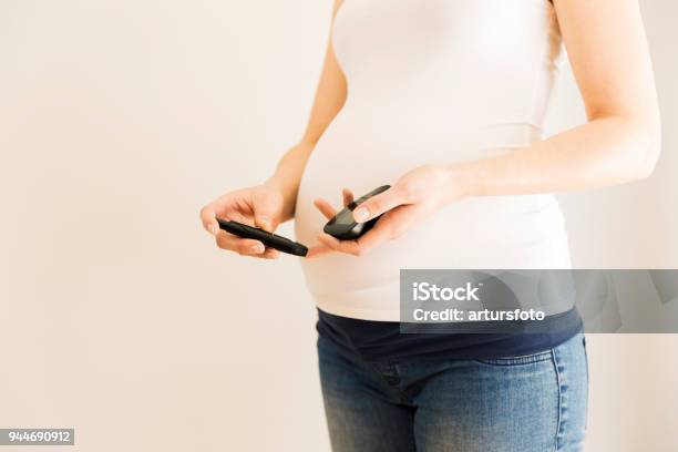 Pregnant Woman Checking Blood Sugar Level Gestational Diabetes Pregnancy Health Stock Photo - Download Image Now