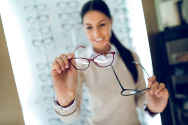 istock Woman selecting eyeglasses in optical store 944696264