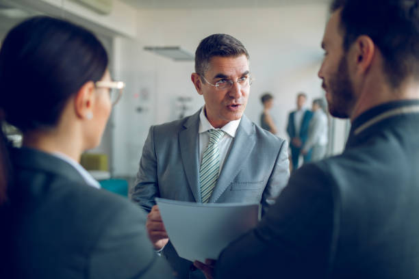 istock Mixed age business people working on some innovative ideas 944698658