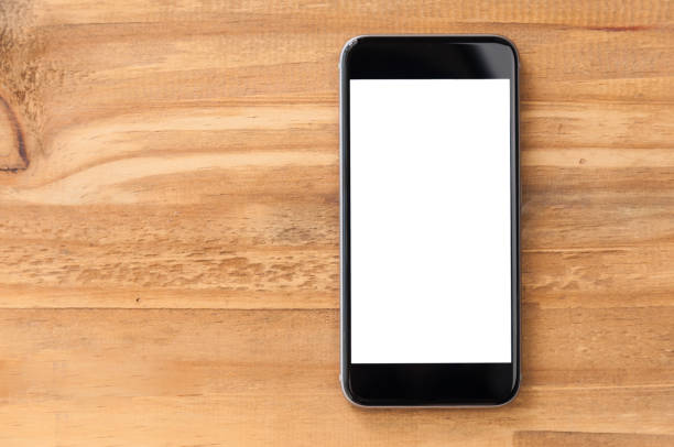 istock Blank screen smartphone on wooden background 944701798
