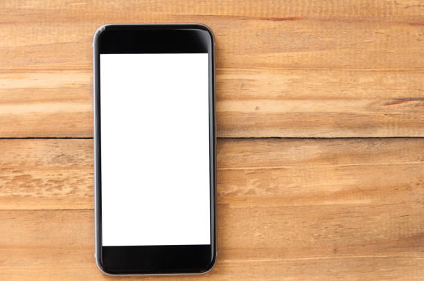 istock Blank screen smartphone on wooden background 944701818