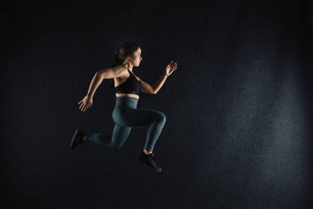 istock Dark-haired lady running indoors 944701824