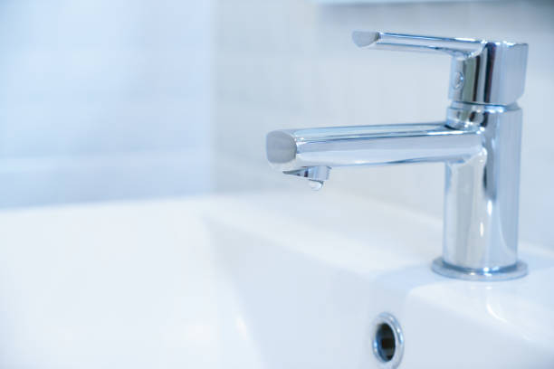istock Close up of driping water drop or water leaking - save water concept. 944706458