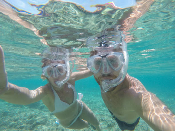 istock Young couple taking selfie underwater, vacations summer concept 944706834