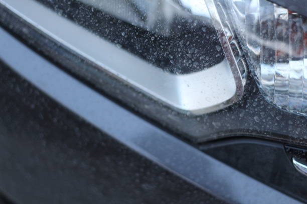 istock Car headlights that dust, The car was not washed 944707726