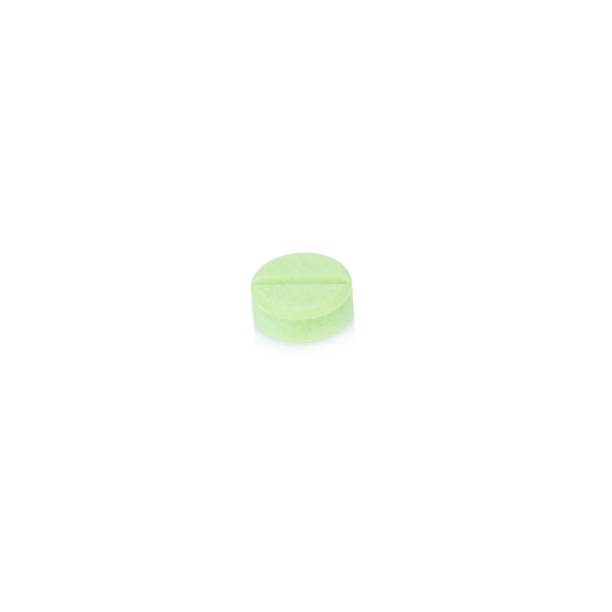 istock pill.  tablet. color green. single. isolated on white background 944710828