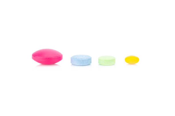 istock pill. tablet. various colors isolated on white background 944711054