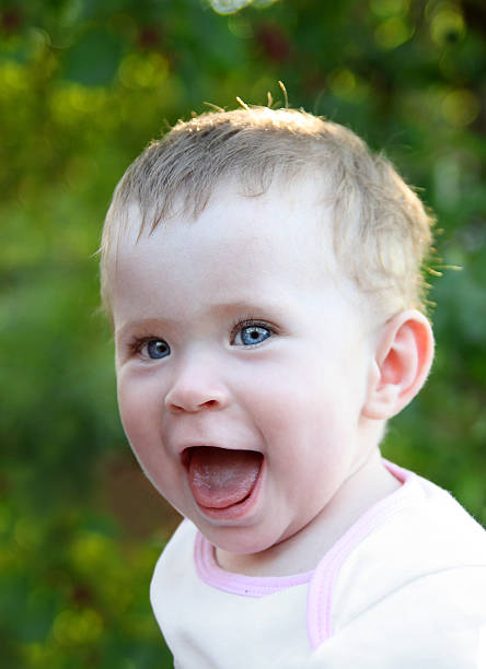 istock happy laughing baby outdoor 94471760