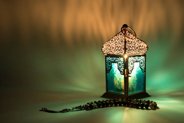 Lantern reflects a special colored lights this kind of photos used as greeting cards for ramadan month and eid, also as a background for some holy book words crescent photos stock pictures, royalty-free photos & images