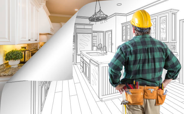 istock Contractor Facing Kitchen Drawing with Page Corner Flipping to Completed Photo Behind 944729478