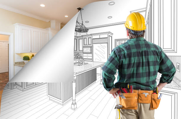 istock Contractor Facing Kitchen Drawing with Page Corner Flipping to Completed Photo Behind 944729490