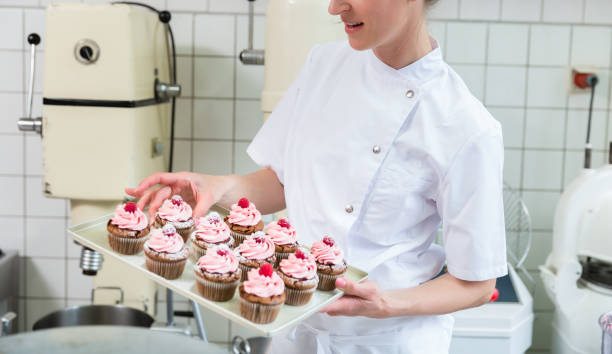 istock Two baker women in pastry bakery working on muffins 944729534