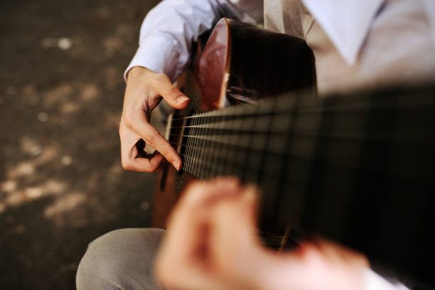 istock Playing on acoustic guitar outdoor. Macrophotography. 944733944