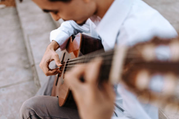 istock Playing acoustic guitar in the city. 944734232