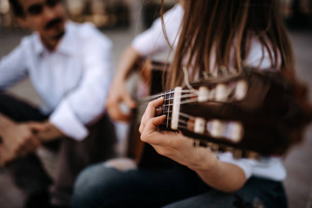 istock Playing acoustic guitar in the city. 944734236