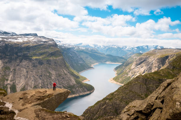 istock Sporty woman posing on Trolltunga Norway 944734596