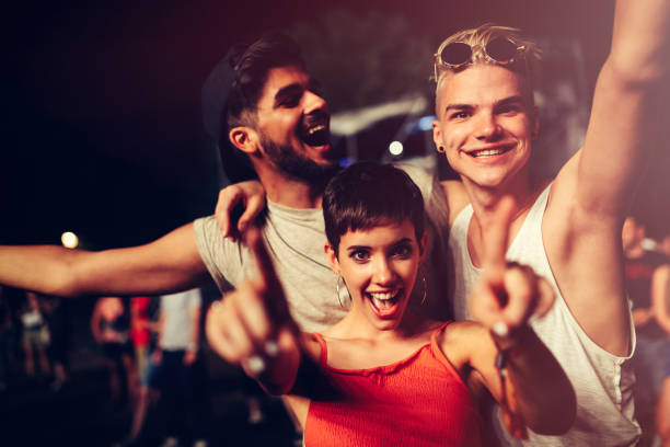 Happy friends having fun at music festival Happy young friends having fun at music festival disco dancing photos stock pictures, royalty-free photos & images