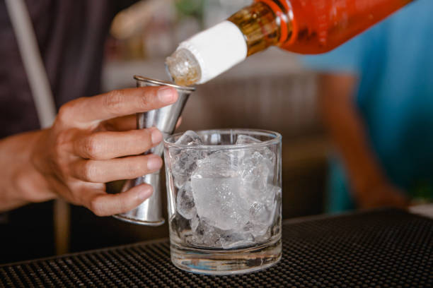 istock Male bartender pouring scotch whiskey 944741398