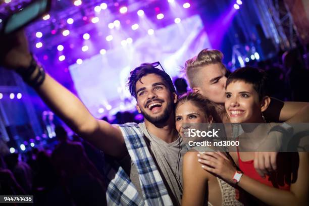 Happy Friends Having Fun At Music Festival Stock Photo - Download Image Now - Selfie, Music Festival, Film Festival