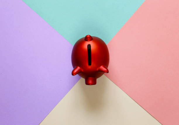 red piggy bank on a colorful background