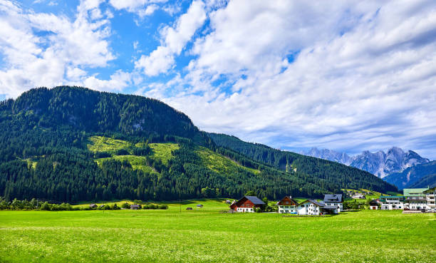 istock Village among green meadows and Austrian Alps 944742066