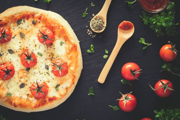 istock Margherita home made pizza. Top view on dark table 944742316