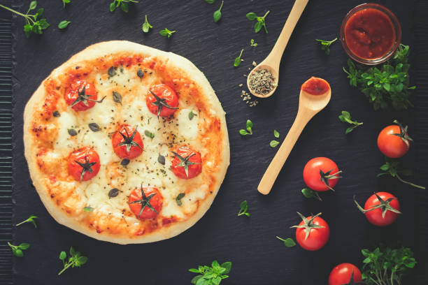 istock Margherita home made pizza. Top view on dark table 944742396