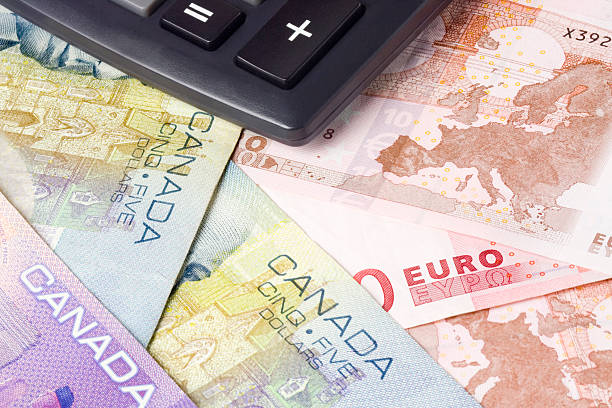 istock Forex - Canadian and Euro currency pair with calculator 94474836