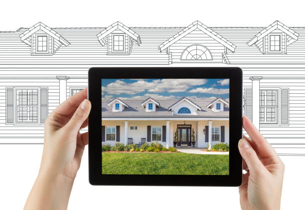 istock Female Hands Holding Computer Tablet with House Photo on Screen & Drawing Behind. 944751222