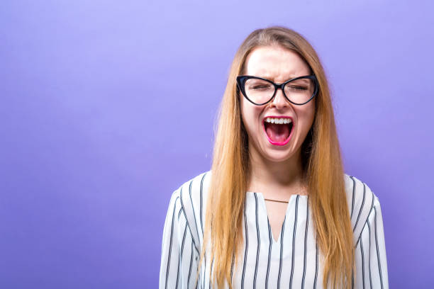 istock Young woman screaming 944756454