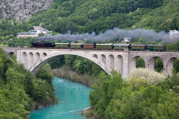 istock Old Steam Train crosing Soca River on Solkan Stone Bridge 944766920