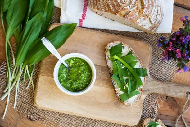 Photo of A slice of sourdough bread with butter and wild garlic, and wild garlic pesto