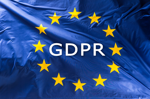 European Union flag with text GDPR -  General Data Protection Regulation.