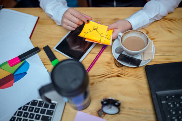 istock Businesspeople Working At Laptop In cafe 944779120