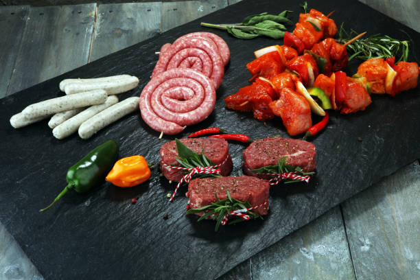 istock Selection of marinaded meat for bbq grilling with herbs on table 944780610