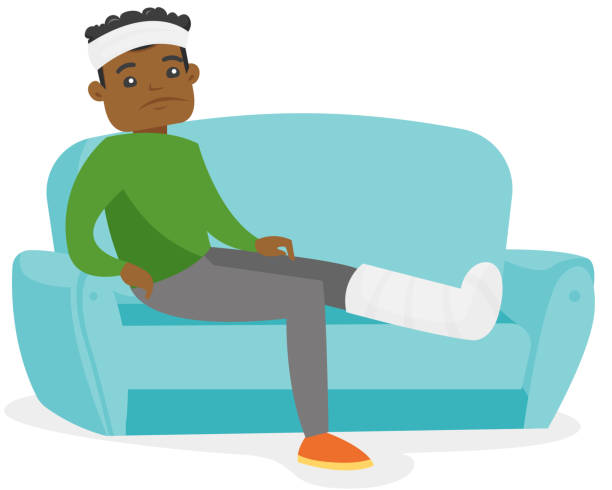afrikanischer mann mit gebrochenem bein auf der couch sitzen - kaputtlachen stock-grafiken, -clipart, -cartoons und -symbole