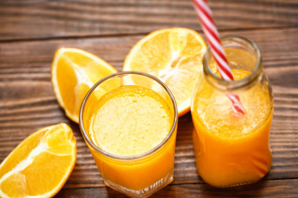 istock orange smoothie in glass 944790488