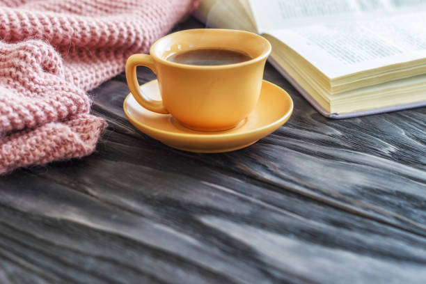 istock open book cup with coffee on a wooden background with copy space, top view 944800134