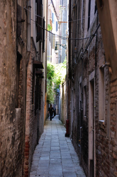 istock narrow lane downtown Venice, Italy 944801018